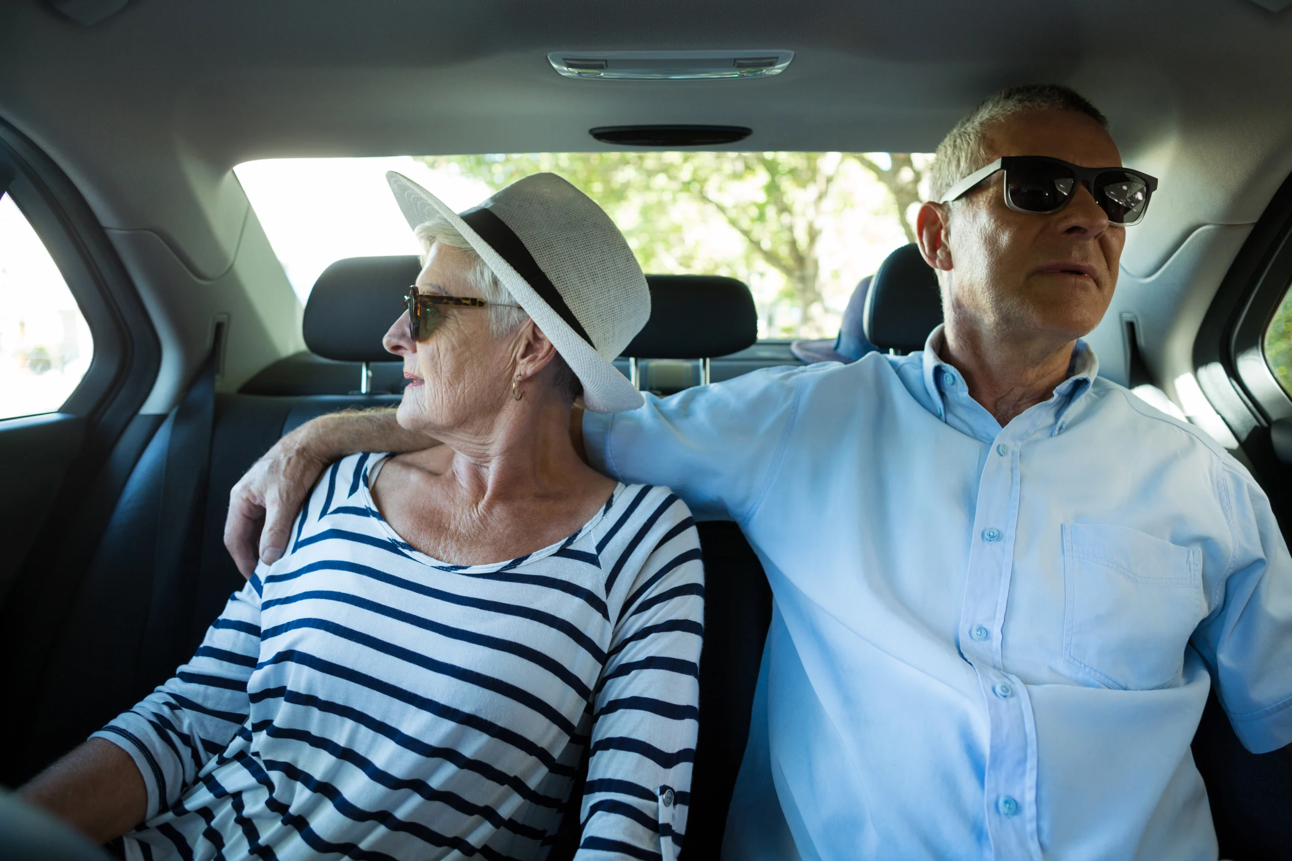 Senior couple sitting in car